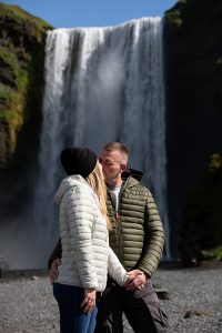 Young Couple kissin in Front of Waterfall in Iceland at an Incentivetravel Travelphotography by EBF Studios Kerstin Seipt